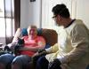 Healthcare worker wearing PPE in nursing home