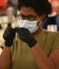 Healthcare worker holding 2 vaccine syringes