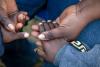 Holding child's hand at Ebola treatment center