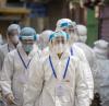 Hong Kong healthcare workers in full PPE