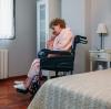 Lonely woman in nursing home wheelchair