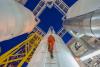 Man climbing tower at gas oil plant