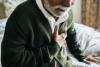 Man having heart attack holding chest