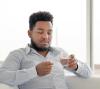 Man taking oral pill
