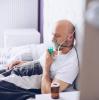 Man with oxygen mask in hospital