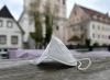 Mask on street table in Austria