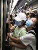 Mask wearing in a crowded subway