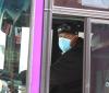 Bus driver wearing surgical mask