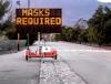 "Masks required" roadside sign