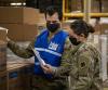 Taking inventory at medical supply warehouse