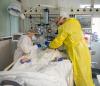 Medical team with hospitalized COVID-19 patient