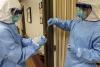 Medics handling a swab