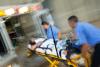 Patient being loaded into ambulance