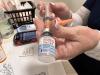 Moderna vaccine being drawn into syringe