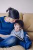Mother reading to sick boy