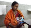 Mother holding baby who has sepsis