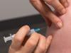 Vaccine needle going into patient's arm