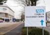 COVID vaccine center sign in England