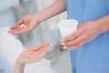 Nurse giving pills