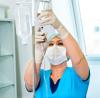 Nursing hanging an IV drip