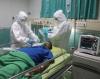 Nurses giving oxygen to ICU patient