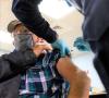 Elderly man getting COVID vaccine
