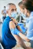 Older man getting vaccinated