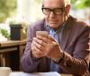 Older man holding smartphone