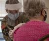 Older woman receiving COVID-19 vaccine