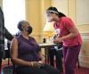 Older woman getting COVID-19 vaccine