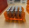 Vaccine vials in orange tray