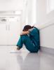 Overworked doc in hallway