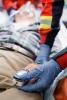 Paramedics monitoring patient's oxygen