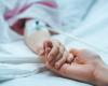 Parent holding child's hand in hospital