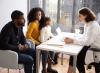 Pediatrician consulting with parents