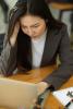 Pensive woman at laptop