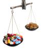 Pills and coins on a scale