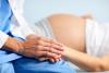 Pregnant woman and doctor