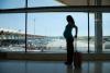 Pregnant woman at airport
