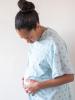Pregnant woman in hospital gown