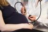 Pregnant woman with doctor