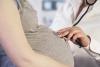 Pregnant woman with doctor