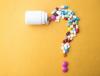 Collection of pills in shape of question mark