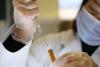 Researcher with COVID vaccine