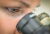 Scientist at microscope