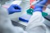 Scientist using a pipette in a lab
