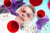 Scientist with bacteria cultures