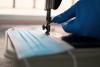 Surgical mask being made on sewing machine