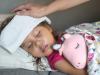 Sick little girl in bed