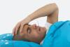 Sick man with thermometer